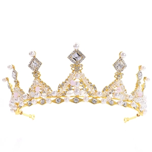 Close-up detail of golden bridal crown with white pearls and sparkling crystals