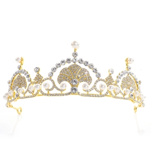 Macro view showing the intricate gold base with white rhinestones and round pearls