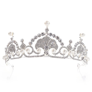 Close-up of bridal crown featuring silver alloy, sparkling rhinestones and white pearls