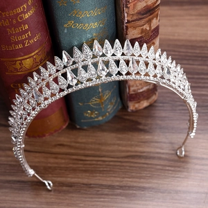 Detail view of silver bridal crown featuring teardrop crystals and sparkling rhinestones