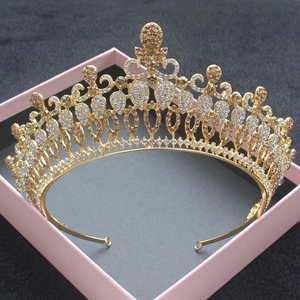 Luxury baroque gold bridal crown with champagne rhinestones in a pink gift box