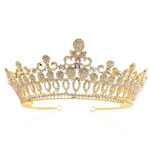 Detailed view of luxury gold bridal tiara with sparkling rhinestones and crystal teardrops