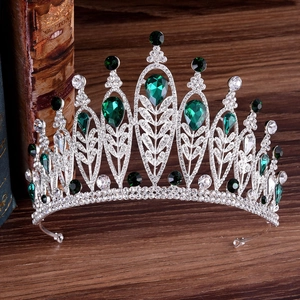 Vintage silver bridal crown with emerald green crystals and sparkling rhinestones