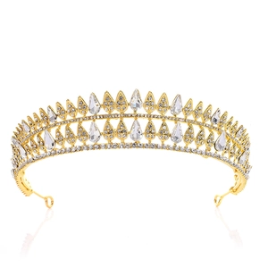 Detail of golden bridal crown with layered teardrop crystals and sparkling rhinestones
