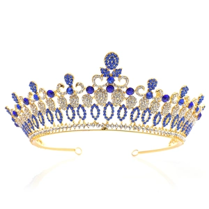 Detail of golden Baroque bridal crown featuring intricate blue and white rhinestones
