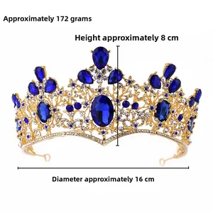 Close-up of royal blue pear-shaped crystals on a golden baroque bridal crown tiara