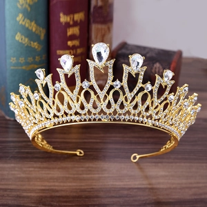 Elegant gold bridal tiara with sparkling crystal rhinestones for wedding hairstyles