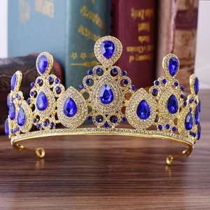 Elegant gold bridal crown with deep blue crystals and white rhinestones for wedding