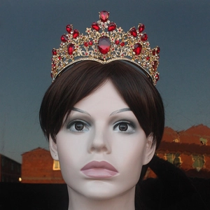 Baroque red crystal bridal crown with ornate golden alloy metalwork and ruby red gemstones