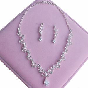 Elegant silver bridal jewelry set with sparkling pear-shaped zircon necklace and earrings