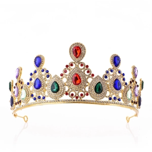 Detail of golden bridal tiara with colorful pear-cut gemstones and sparkling rhinestones