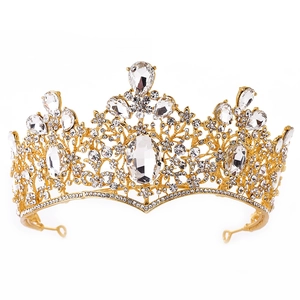 Detailed close-up of Baroque gold bridal crown with crystals and floral metalwork