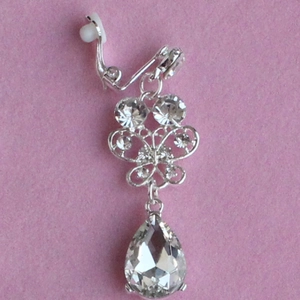 Silver bridal jewelry set featuring butterfly drop earrings with pear-shaped crystals
