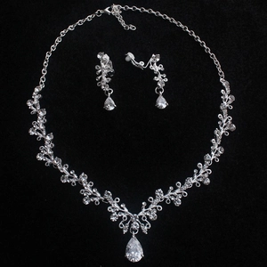 Elegant silver bridal necklace and pear-cut zircon earrings jewelry set on black background
