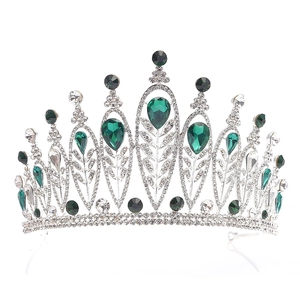 Detail of baroque silver tiara with emerald green teardrop crystals and rhine-stones