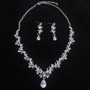 Elegant silver bridal jewelry set with sparkling rhinestones and pear-shaped pendants