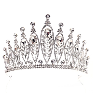 Detailed macro view of baroque silver bridal tiara with rhinestones and leaf motifs