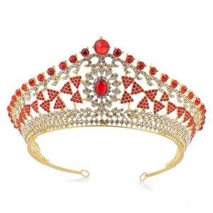 Elegant gold bridal crown featuring red gemstones and sparkling white rhinestones