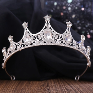Detailed macro view of silver bridal crown featuring oval crystals and ornate scrollwork