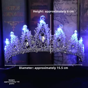 Detail of bridal crystal crown with glowing blue LED lights on silver metal frame