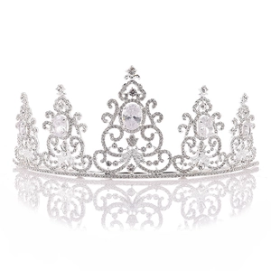 Elegant silver bridal crown with white rhinestones and large oval crystals on mirror surface