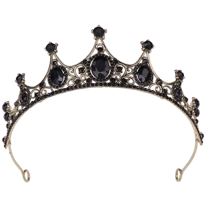 Close-up of gothic bridal tiara with black rhinestones and vintage bronze filigree