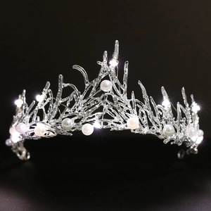 Elegant LED bridal tiara with silver coral branches, pearls and fairy lights for weddings