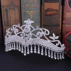 Elegant silver bridal crown with cascading rhinestones and tassel details for weddings