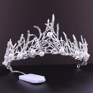 LED bridal crown with silver coral branches and white pearls on black background