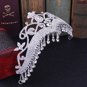 Luxurious silver bridal crown with crystal tassels and intricate leaf patterns