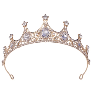 Detailed macro view of sparkling crystal rhinestones on a gold bridal tiara crown