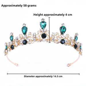 Baroque gold crown featuring emerald green gems and intricate cutout details for bridal wear