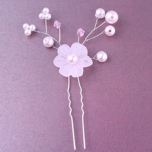 Detail of pink resin flower hair pin with pearls and crystals on silver wire