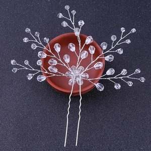 Elegant bridal hair pin with silver crystal branch and U-shaped pins for wedding hairstyles
