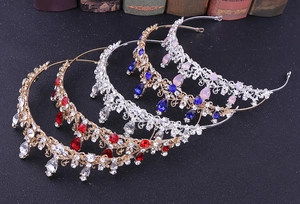 Detail view of vintage crystal bridal crowns in diverse gold and silver color options