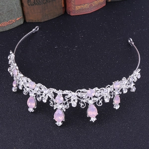 Detail of silver bridal crown with pink teardrop crystals and vintage hollow metalwork