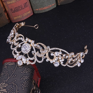 Macro view of rose gold bridal tiara with sparkling crystal rhinestones and filigree design