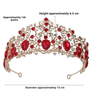 Detail view of gold bridal crown with red rhinestones weighing 120g and 15cm diameter