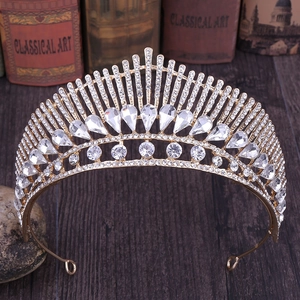 Detailed macro of golden peacock tail bridal crown with pear-shaped rhinestones