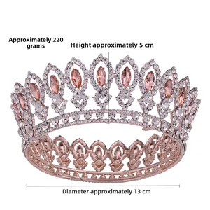 Detailed view of silver baroque crown with pink rhinestones, 5cm high and 13cm diameter