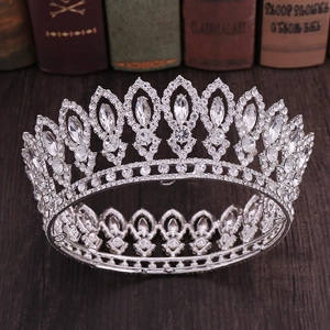 Elegant Baroque round bridal crown with silver alloy and crystals on vintage wood