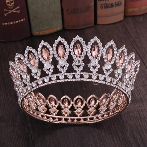 Detailed macro of vintage baroque crown featuring pink marquise stones and crystals