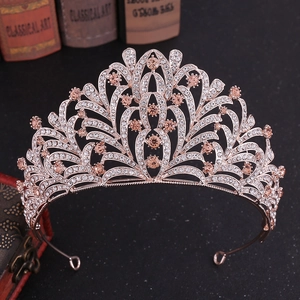 Close-up detail of leaf patterned bridal tiara with rose gold alloy and rhinestones