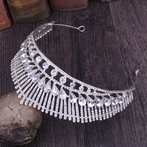 Detailed close-up of peacock tail alloy bridal tiara with sparkling crystal rhinestones