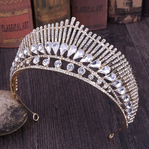 Elegant gold bridal crown with peacock-tail design and sparkling white crystals