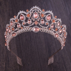 Detail view of rose gold bridal tiara with sparkling champagne crystals and hair comb