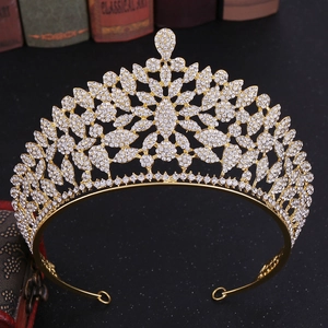 Luxury gold bridal crown with white rhinestones on vintage book and jewelry box