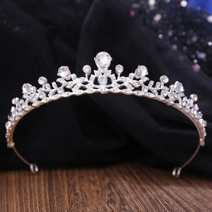 Macro detail of bridal crown with silver alloy, teardrop crystal, and sparkling rhinestones