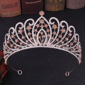Close-up of rose gold bridal crown with champagne crystals and intricate diamond settings