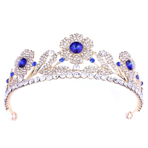 Elegante tiara da sposa dorata con cristalli blu e design a foglie floreali